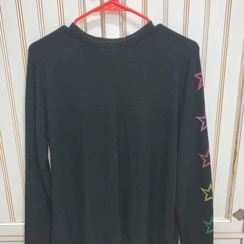 Black long sleeves shirt. Stars on sleeve.